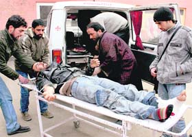 A man, who was injured in an attack by gunmen in Sopore on Thursday, being taken to hospital by relatives