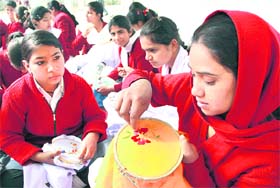 Differently abled girls from the Red Cross School for Deaf show their embroidery in Jalandhar