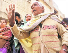 A woman from riot-hit families argues while making an attempt to occupy GLADA flats in Dugri, Phase II, Ludhiana, on Thursday.