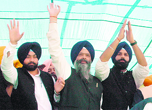 Bikramjit Singh Majithia (right) and Prem Singh Chandumajra at a rally in Patiala on Thursday. 
