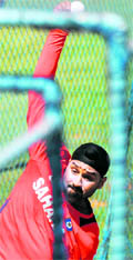 Harbhajan Singh bowls during a training session in Bangalore on Thursday