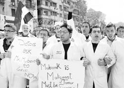 Egyptian doctors and medical students join the anti-government demonstration at Tahrir Square in Cairo on Thursday. 