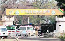 Ambulances enter the Punjab Regiment Centre where the suicide bomber blew himself up in Mardan, 30 km from Peshawar, on Thursday.