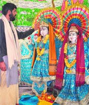 A priest of the Prachin Shiv Mandir points at the missing jewellery from the idols on Friday.