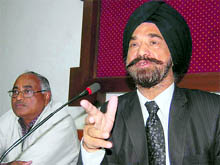Manmohan Singh, Commissioner, Customs and Central Excise, Meerut division, addresses a press conference in Dehradun on Friday