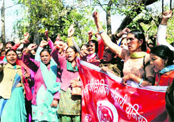 Anganwari workers hold a protest at the Gandhi Park during the launch of the Atal Khadyaan