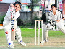 A batsman in action in the final of the Junior Boys Council School Cricket Tournament in Dehradun on Friday