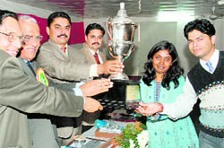 Benaras Hindu University team lifts the winners trophy of the national debate competition held at Sardar Bhagwan Singh Institute, Balawala, on Friday