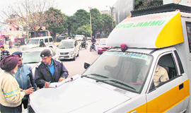 Traffic and State Pollution Control Board officials at a naka at Panama Chowk 