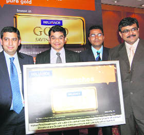 Reliance Capital Asset Management CEO Sundeep Sikka (First from left) at the launch of Reliance Gold Savings Fund in Chandigarh.