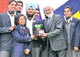 Eminent educationist Shomie R. Das presents a trophy to students at the Founders Day function of Yadavindra Public School, Mohali
