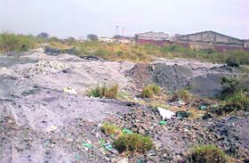 Harmful ash dumped near Saidpura village on the Dera Bassi-Barwala road