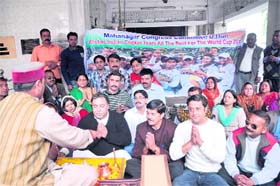 Congress workers hold a special puja for the success of the Indian cricket team in the forthcoming World Cup in Dehradun