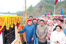 Chief Minister Prem Kumar Dhumal inaugurates the Trilokpur Bridge on the Pathankot-Mandi National Highway No 20 on Saturday. 