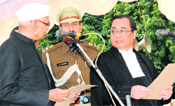 Haryana Governor Jagannath Pahadia administers the oath of office to Chief Justice Ranjan Gogoi in Chandigarh 