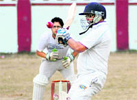A batsman tries to hit a bouncer in a match of the Uttarakhand Cup Beehive Challenger League in Dehradun on Sunday.