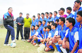 Former International football player Shyam Thapa gives tips to trainees of Maharana Pratap Sports College in Dehradun on Sunday.