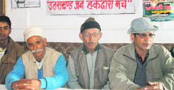 Members of the Uttarakhand Jan Hakdari Manch address the media in 
