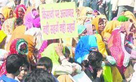 Women attend a mahapanchayat at Pachgaon Chowk near Manesar to chalk out a strategy to prevent the acquisition of fertile land