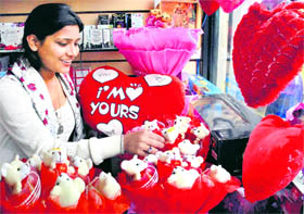 A young girl chooses a Valentines Day gift at a shop in Model Town in Jalandhar.