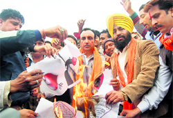 Activists of the Shiv Sena burn Valentines Day cards during a protest held on Sunday 