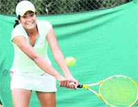 A player in action during a match of the CLTA-AITA Championship Series Tennis Tournament in Chandigarh on Monday. 
