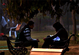 A young couple exchanges sweet nothings in a park at Gurgaon.