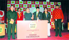 Kaustabh Chaturvedi receives a prize from Prashant Tiwari, Zonal Operations Head, Dehradun, Idea Cellular, in Dehradun on Monday.