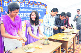 Students participate in a potato-peeling game during the farewell party of RS Public Senior Secondary School in Karnal.