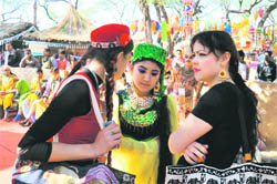 Artistes take a break at the Surajkund Crafts Mela in Faridabad. 