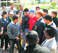 Dr Bruce Kidd, chairman of the Commonwealth Advisory Board on Sports, interacts with youths at Rai sports school in Sonepat.