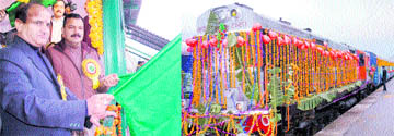 Deputy Chief Minister Tara Chand flagged of the Janambhoomi Express, a new weekly train started between Udhampur and Ahmedabad, at Udhampur railway station on Monday.