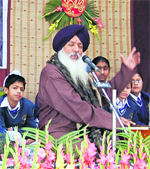 Madan Gopal Singh performs during a musical programme at DAV International School in Amritsar.