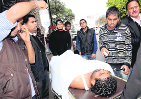 Narinder Gujjar, who was injured in an assault, at the GMSH, Sector 16, Chandigarh, on Tuesday. 