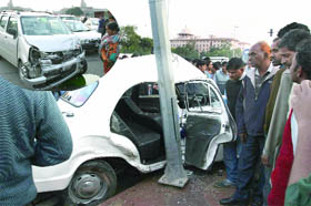 The mangled remains of an escort car and a private vehicle after their collision at Rajpath-Rafi Marg crossing on Tuesday evening. 