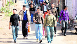 Candidates return from an Army recruitment rally at the Sunjuwan Military Station, near Jammu, on Tuesday.