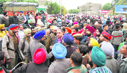 Angry shopkeepers block traffic on the Ferozepur road near Aggar Nagar in Ludhiana