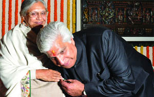 Ramakant Goswami greets Chief Minister Sheila Dikshit after taking oath in New Delhi on Wednesday.