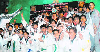 The Dehradun taekwondo team, after their return from the Kashi Ram Open National Taekwondo Championship at Bareilly, in Dehradun on Wednesday.