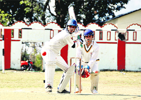 A batsman gets ready to hit the ball in a match of the 60th District Cricket League at the Survey of India stadium in Dehradun on Wednesday. A Tribune photograph