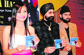 Harjeet Singh Titlee, a pop singer, with Miss Uttarakhand 10 Bahar Kaur at the launch of a CD dedicated to the cricket World Cup in Dehradun on Wednesday.