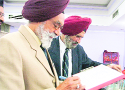 Signature Campaign: Col RS Sohi signs an undertaking against black money lying in Swiss banks and corruption during the centenary function of the Signal Corps in Ludhiana on Tuesday.