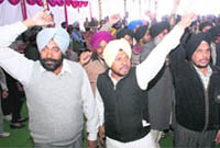Agitating farmers stage a protest at the Chief Ministers Sangat Darshan programme in Rajpura on Wednesday.
