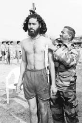 An Army man measures the height of a potential recruit at a recruitment rally at Khasa, near Amritsar, on Wednesday