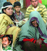 The family members of Paras Ram (inset) mourn his death at thier residence in the Tilak Nagar area of west Delhi on Thursday.