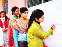 Students of SMJN College line up to sign for a signature campaign in Haridwar on Wednesday.