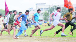 Students participate in an 800-metre race during the 61st annual athletic meet of Dyal Singh College in Karnal.
