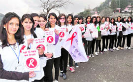Girls participate in an AIDS awareness rally organised by the HP AIDS Control Society in Shimla on Thursday