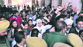 Members of the All-J&K Physiotherapists Association hold a demonstration in Jammu