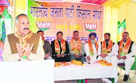 State president of the BJP Shamsher Singh Manhas addresses party workers at a kisan sammelen at Nagbani in Jammu